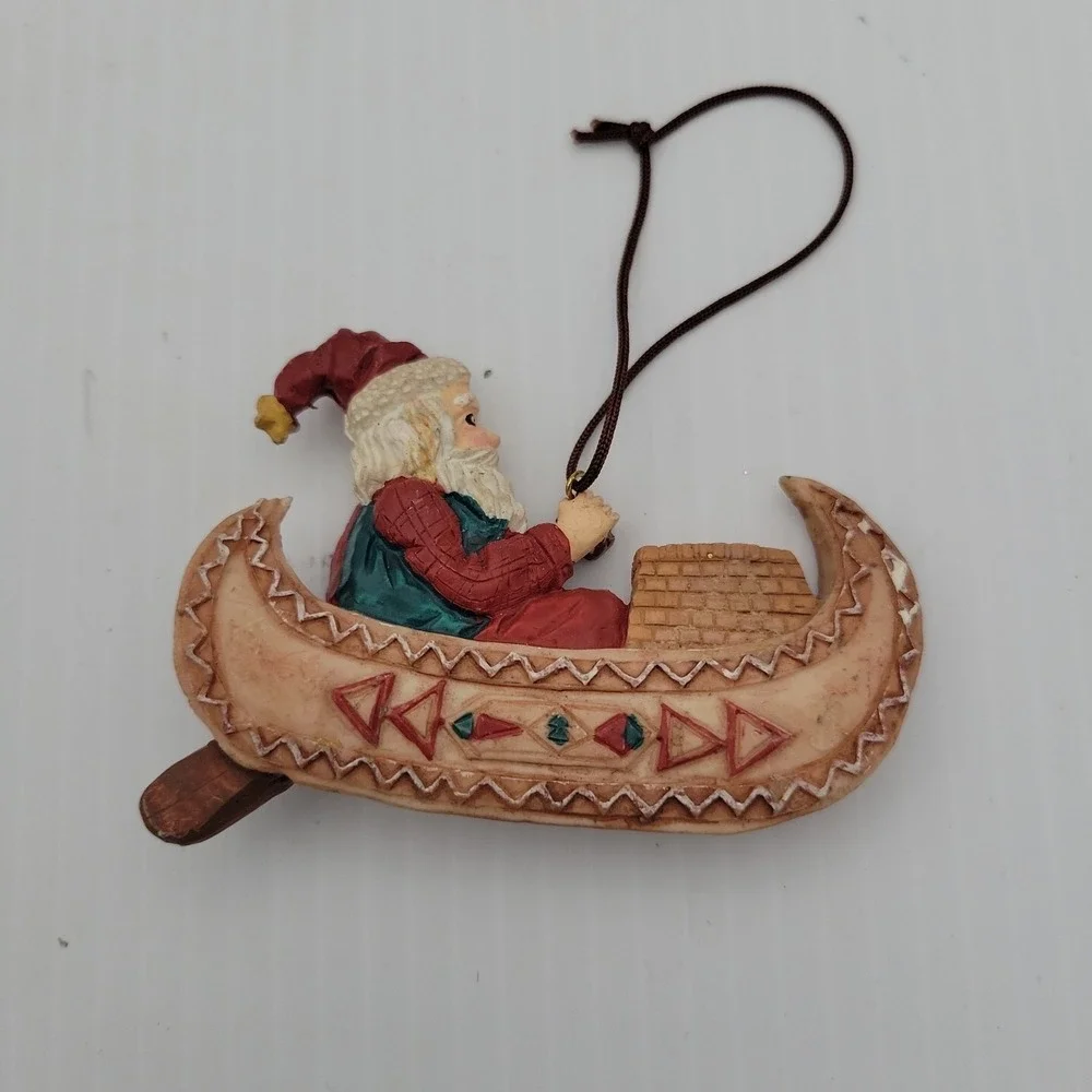 Kurt Adler Santa Claus Paddling Canoe Folk Art Christmas Ornament Resin Vintage